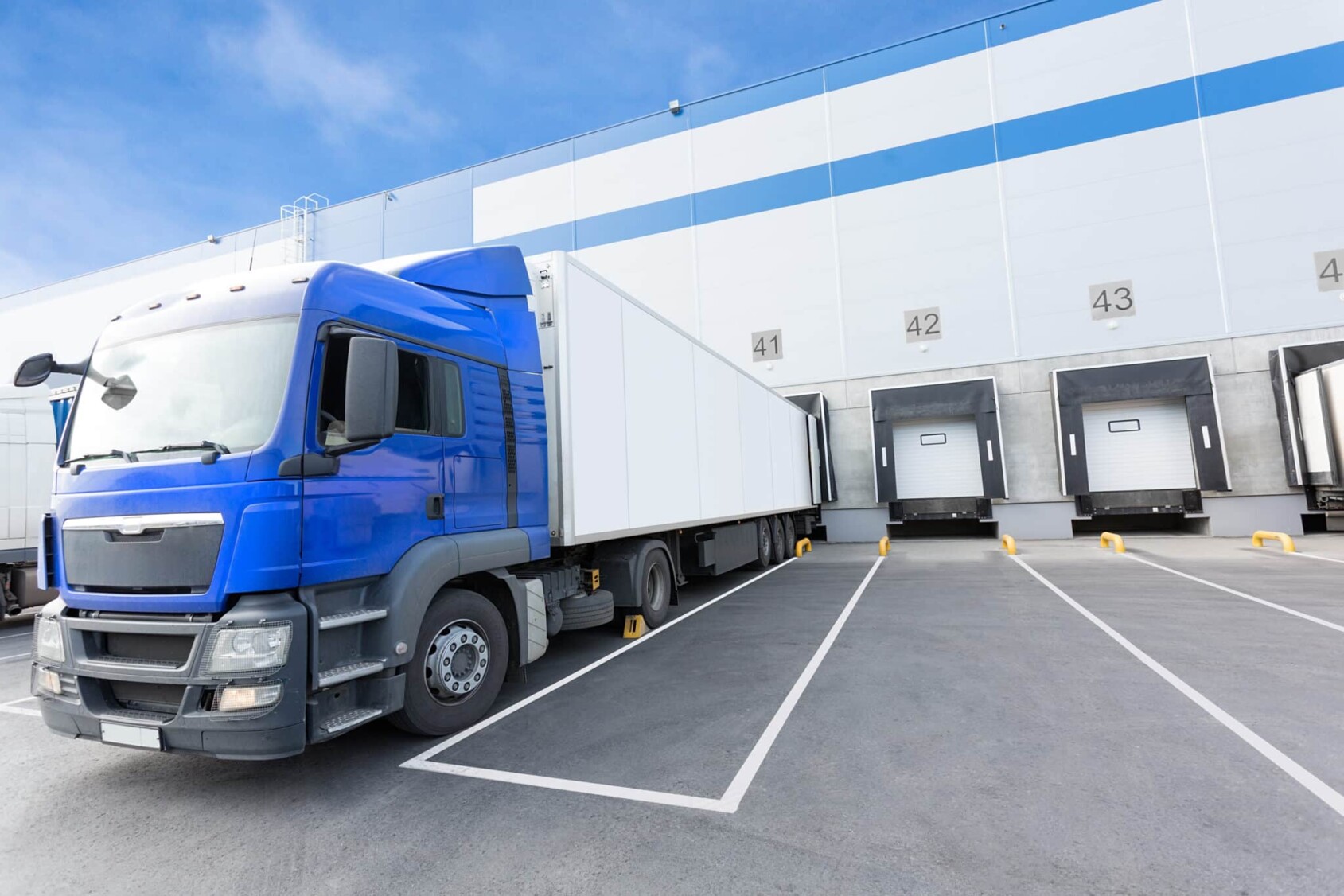 Blue Truck And Gates Of Big Distribution Warehouse