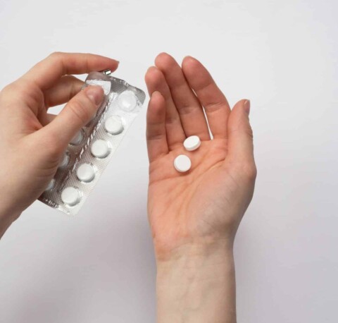 Hands holding prescription medication